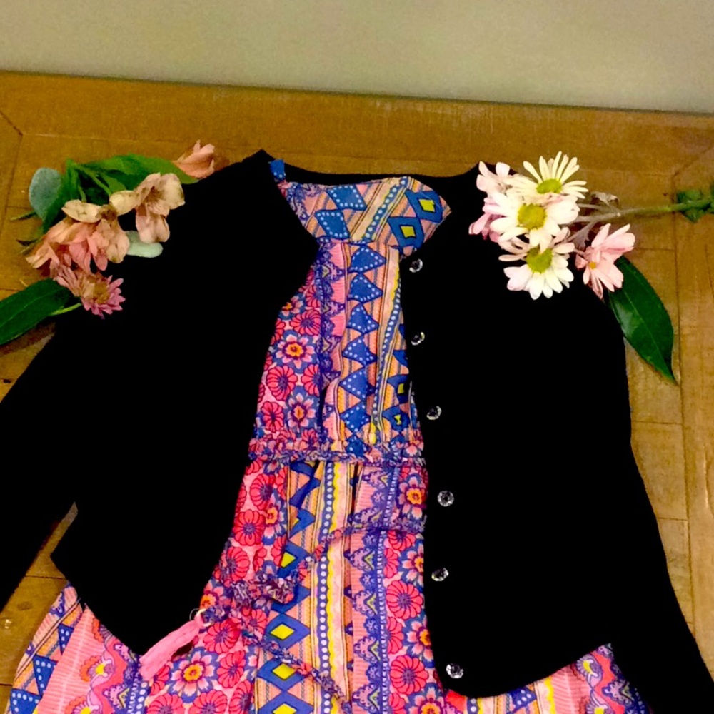 A  floral dress with a black cardigan.